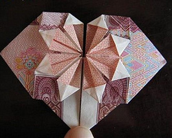 非常漂亮的纸折心教程 用人民币折纸心diy图解